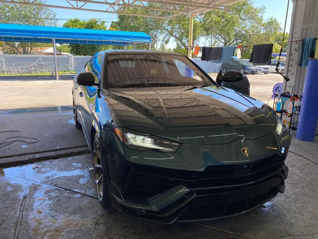Dark green Lamborghini Urus after a full detail