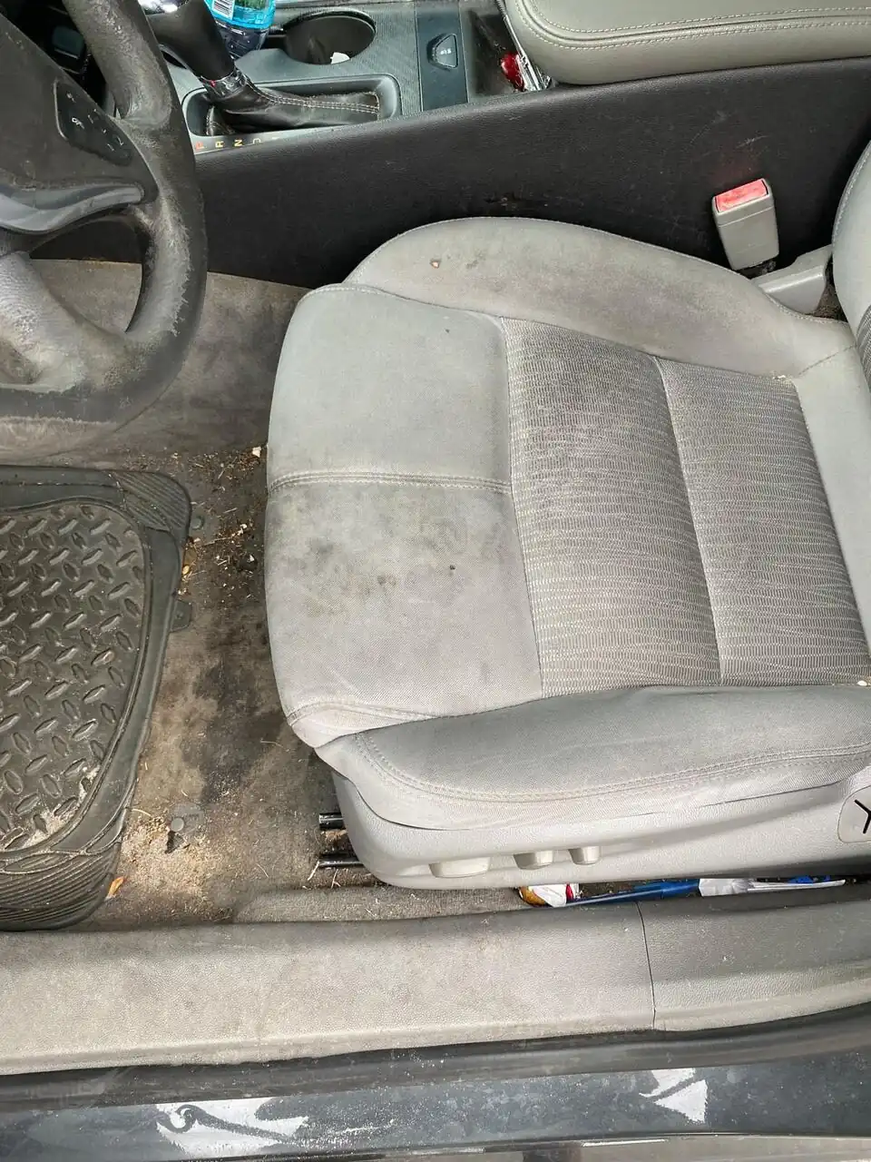 Heavily soiled cloth seat before an interior deep clean