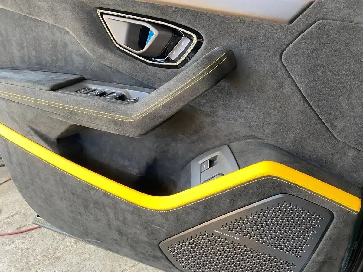Lamborghini door panel with yellow stitching detail