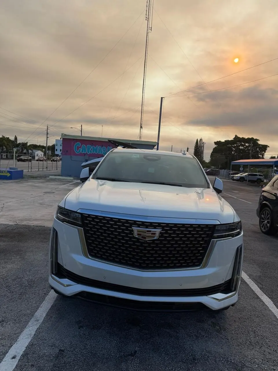 White Cadillac SUV front end, clean exterior