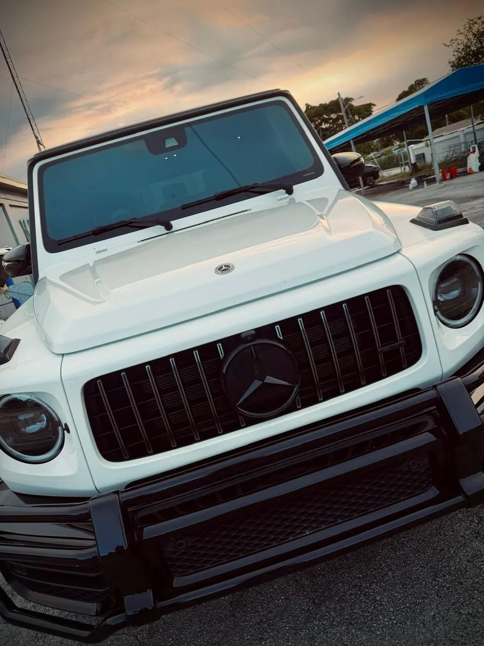 White Mercedes-AMG G63 front view, close-up