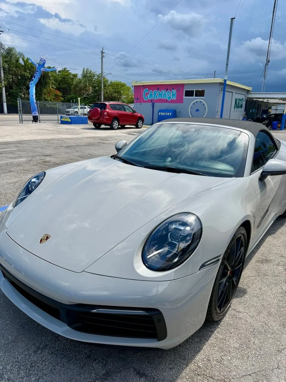 White Porsche 911 convertible front, alternate angle