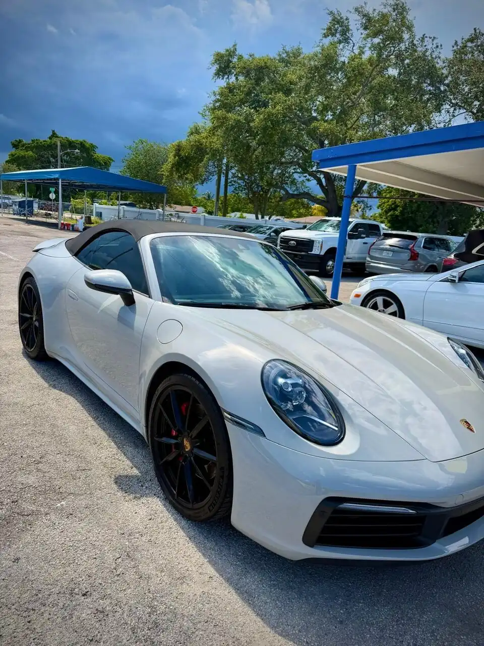 White Porsche 911 convertible side view