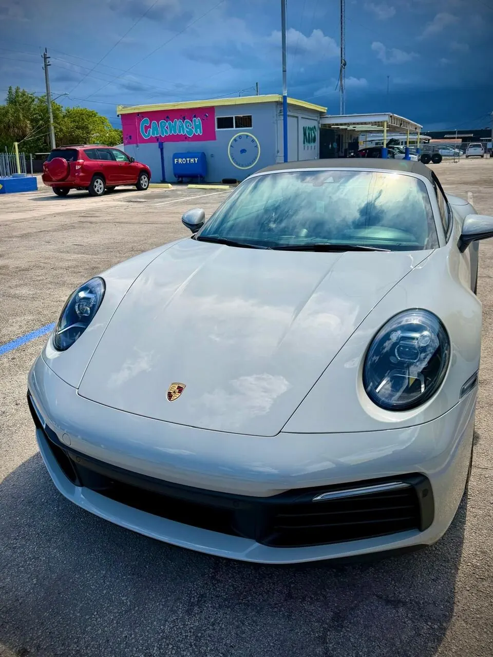 White Porsche 911 front view, alternate angle