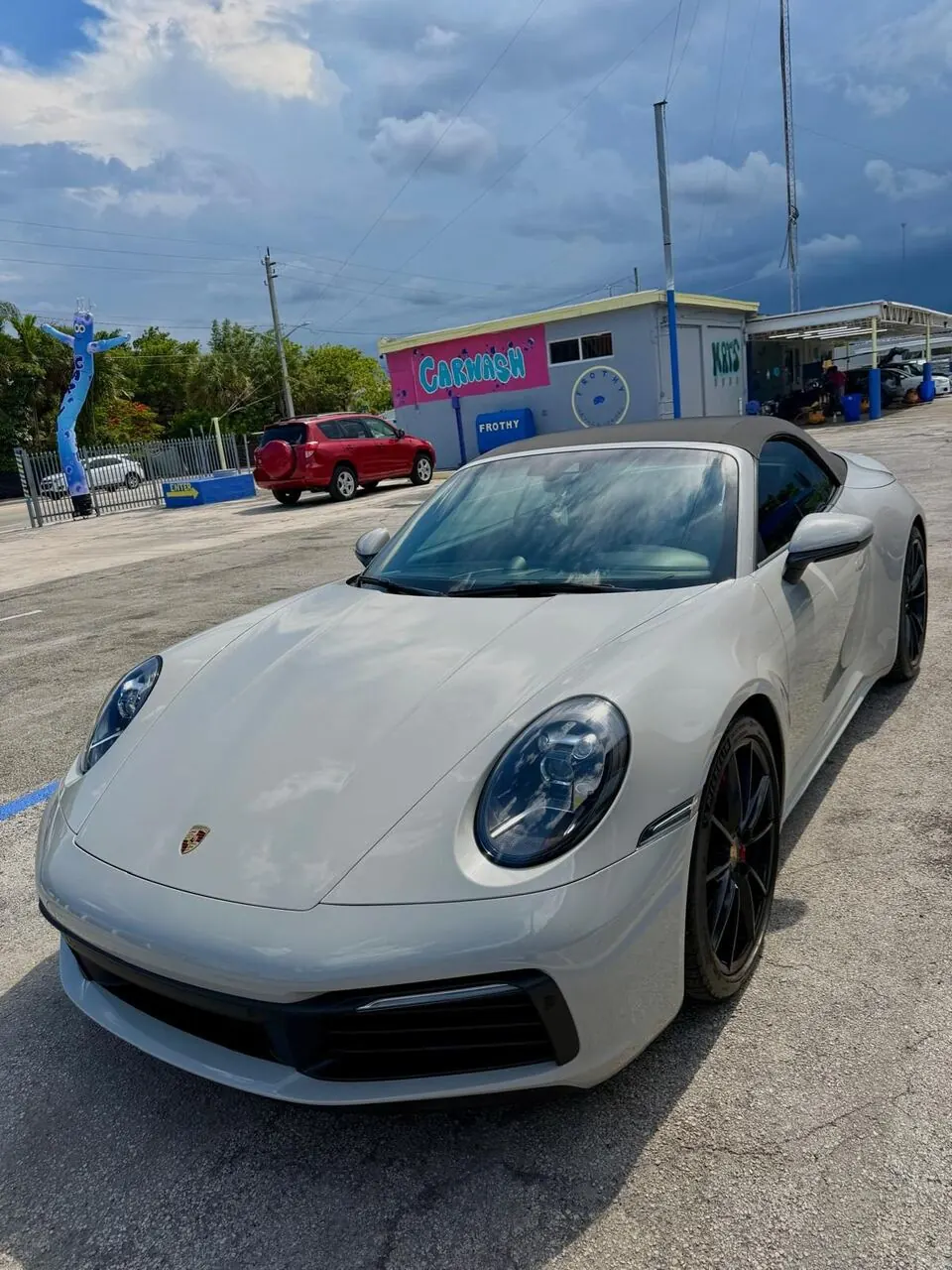 White Porsche 911 front view, alternate angle