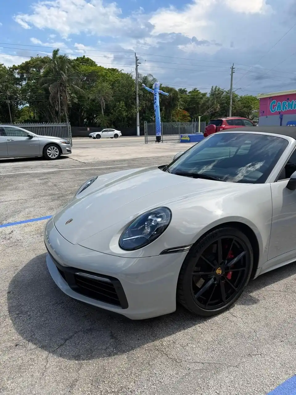 White Porsche 911 front view, close-up