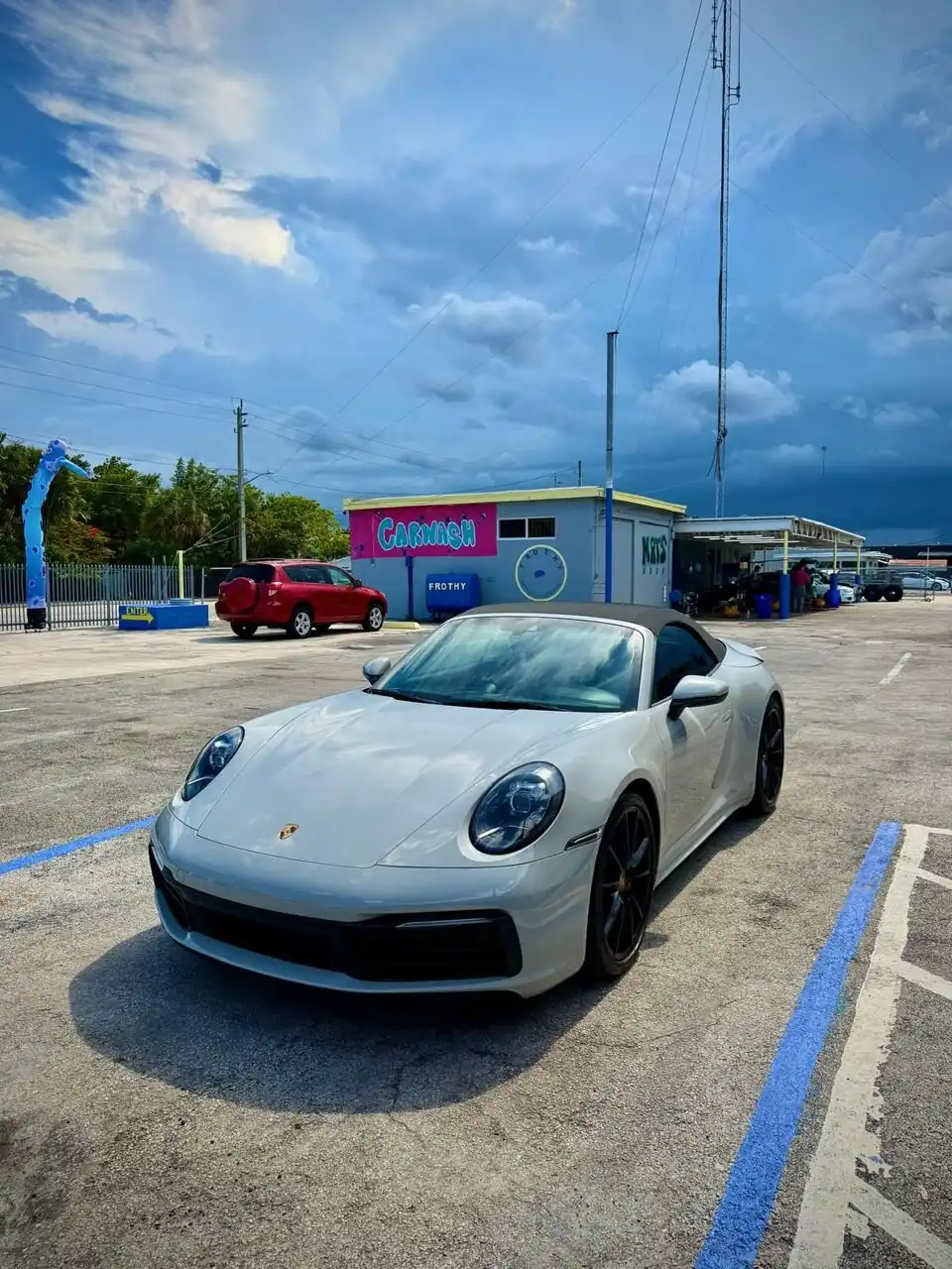 White Porsche 911 front view, glossy finish